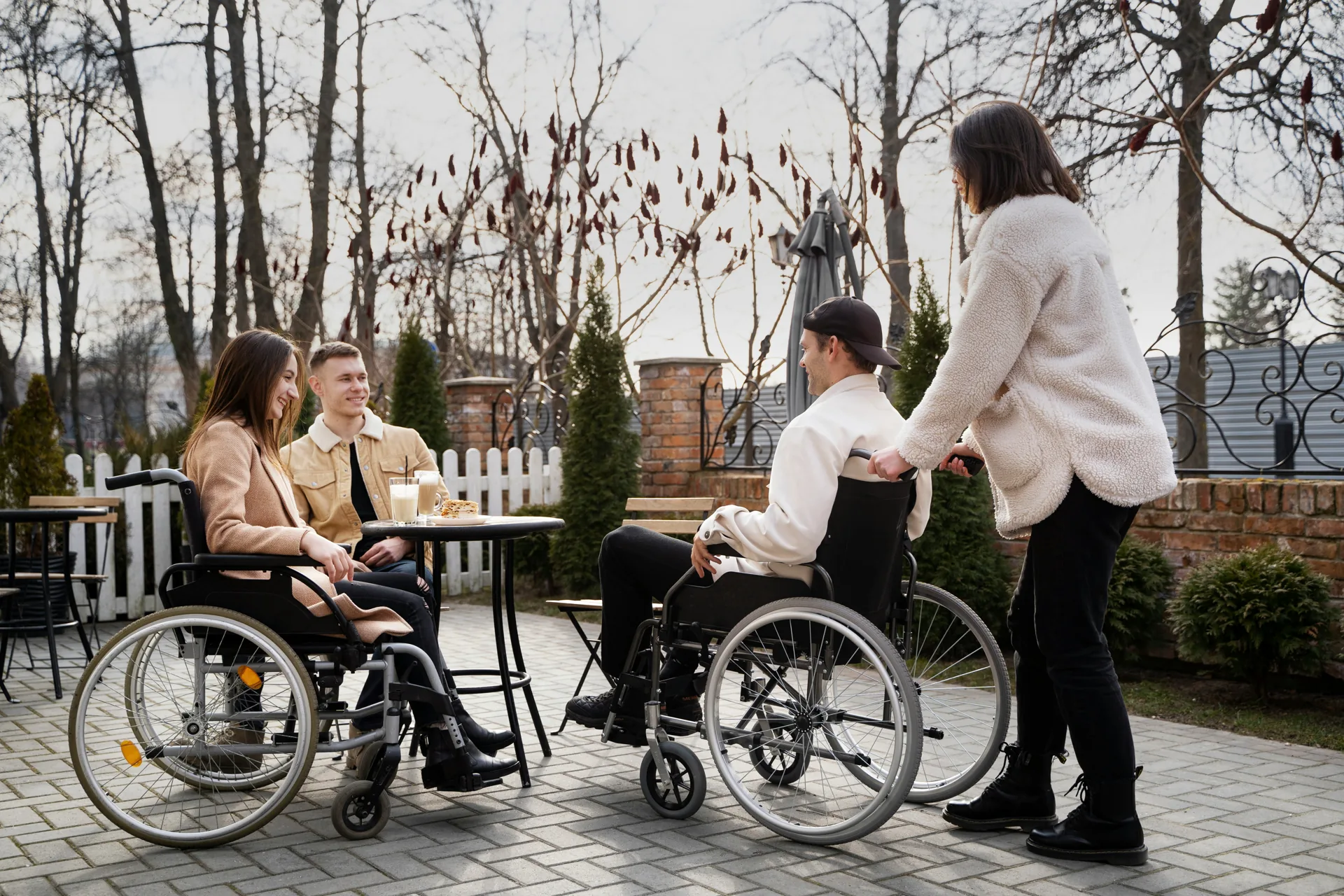 Friends and support workers enjoying time together in the community